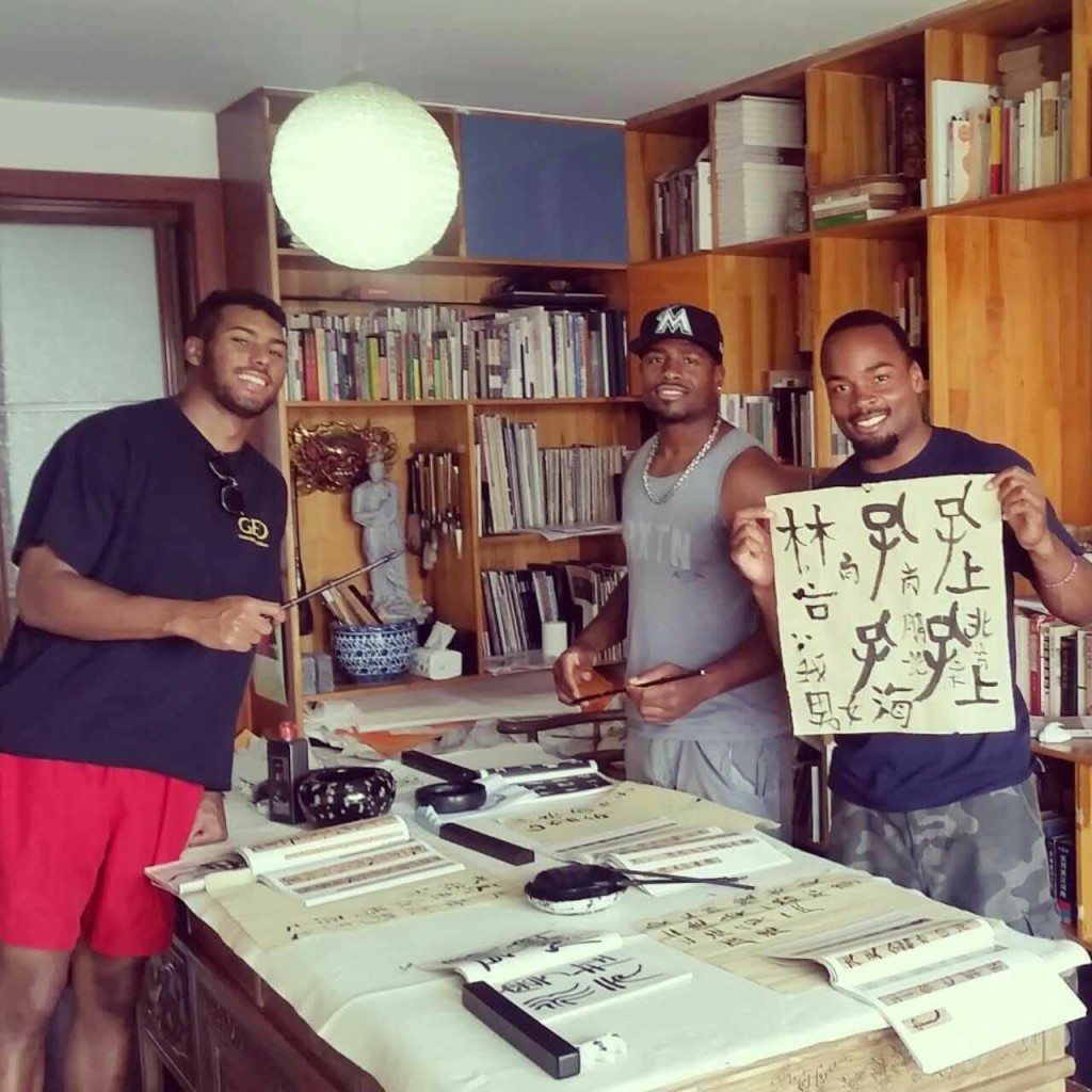 Image 15 – (left to right) Darien, Vladimir _ Floyd at Calligraphy lessons