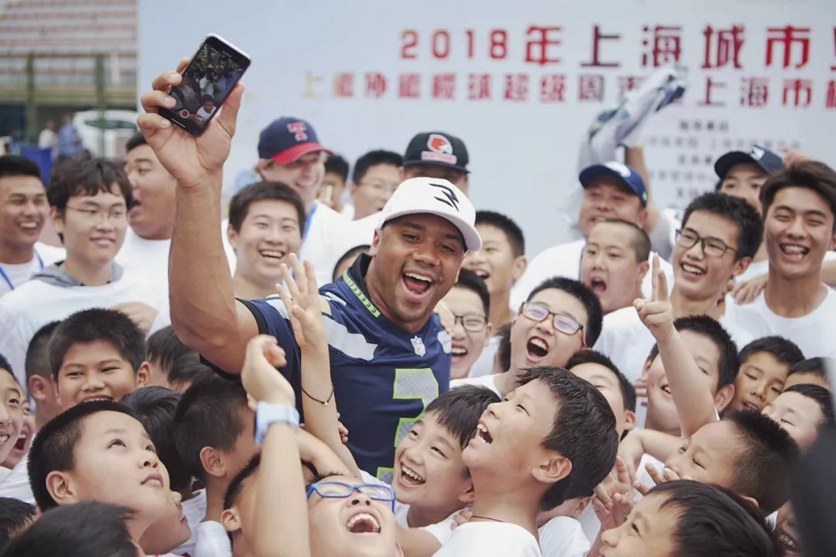 Russell Wilson on China visit talks up Alibaba, the global rival to  Seattle-based