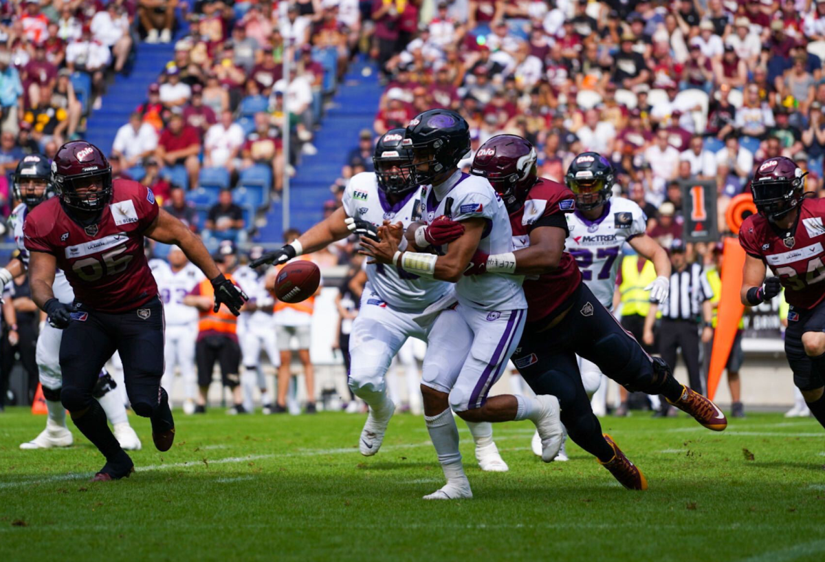 Players from Frankfurt Galaxy and Rhein Fire in action during the