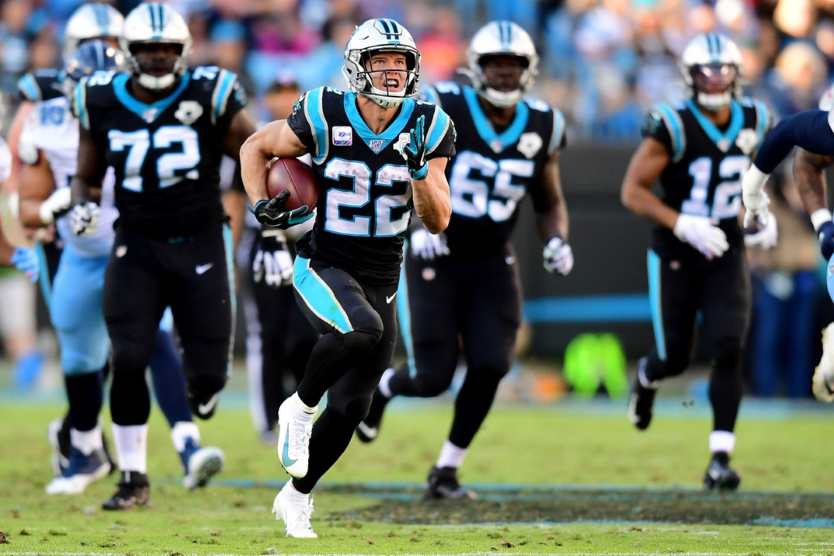 McCaffrey scores three touchdowns as Panthers beat Titans