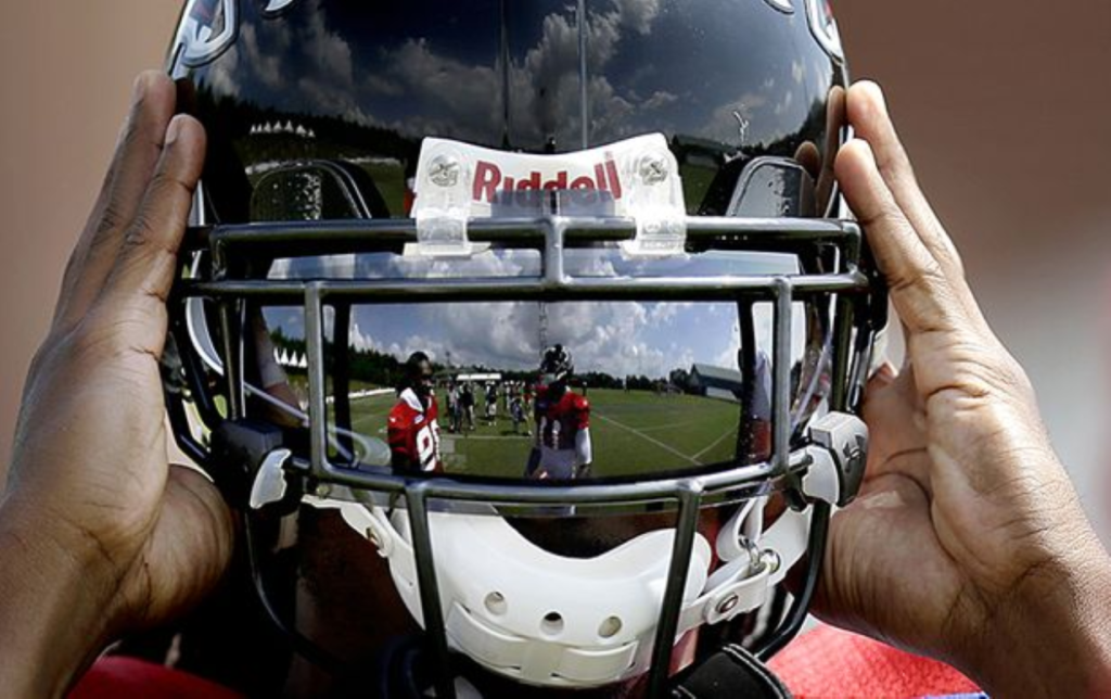 NFL studying helmet face guard that works like surgical mask