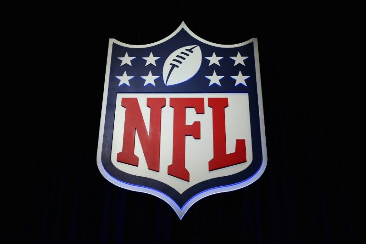 Football With Nfl Logo Against A Black Background, Pictures Of The